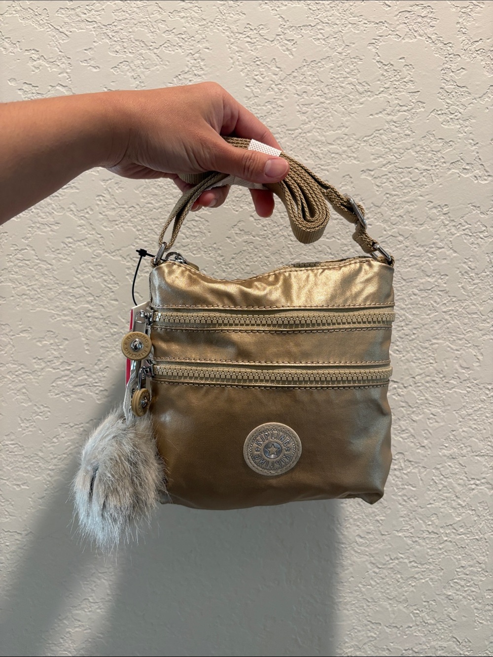 NWT Kipling Metallic Gold Crossbody Bag with Fur Charm